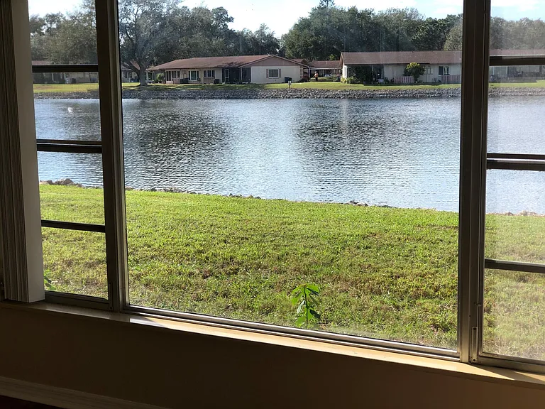 FULL PICTURESQUE LAKE VIEWS FROM OWNERS BEDROOM