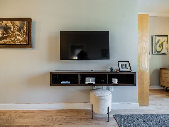 built-in TV (with extra long arm to face dining or living area, and music system with SONOS app