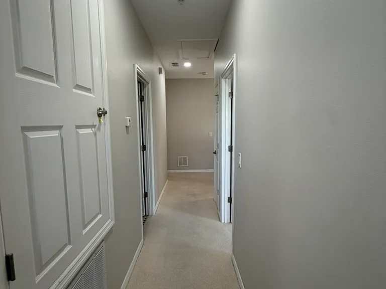 Hallway leading to the primary bedroom