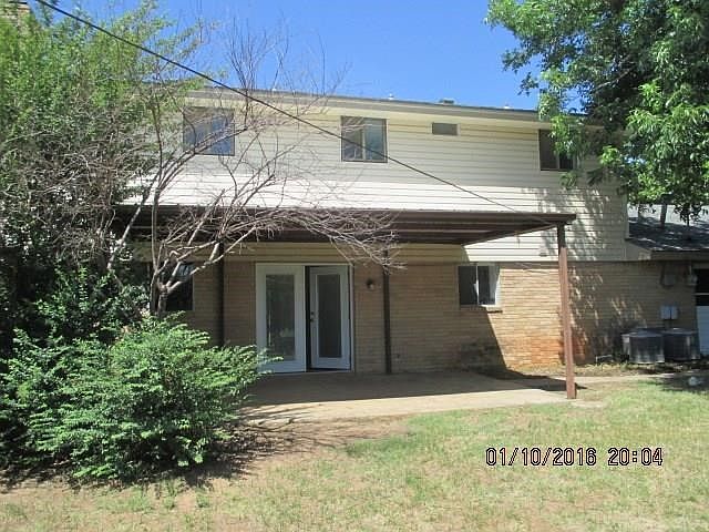 Back of house has covered patio