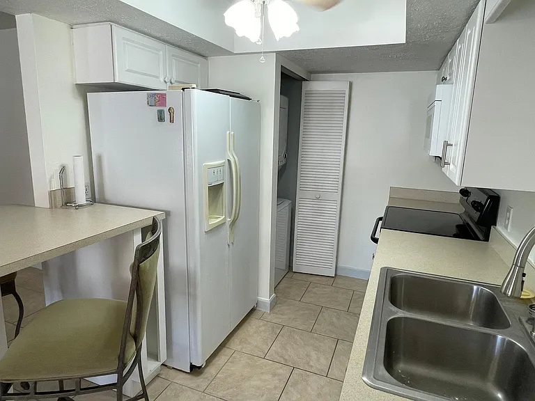 Kitchen with side by side fridge...