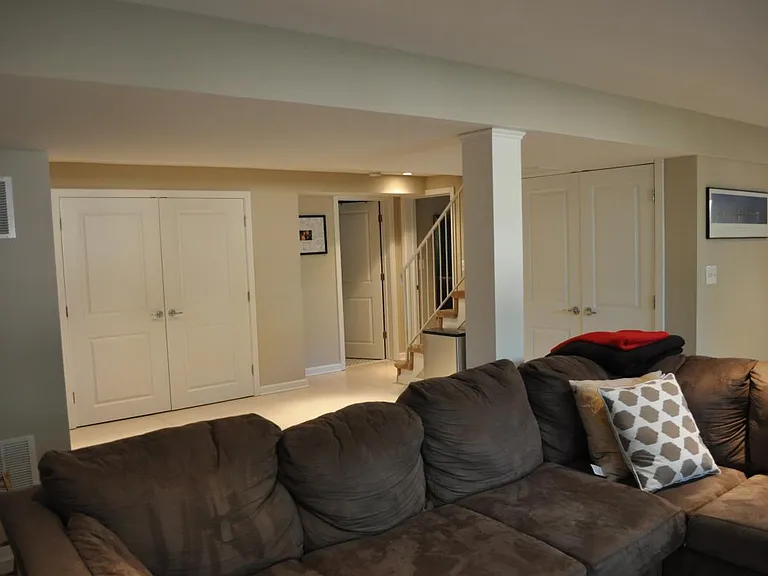 finished basement with laundry, utility, storage, bedroom, f