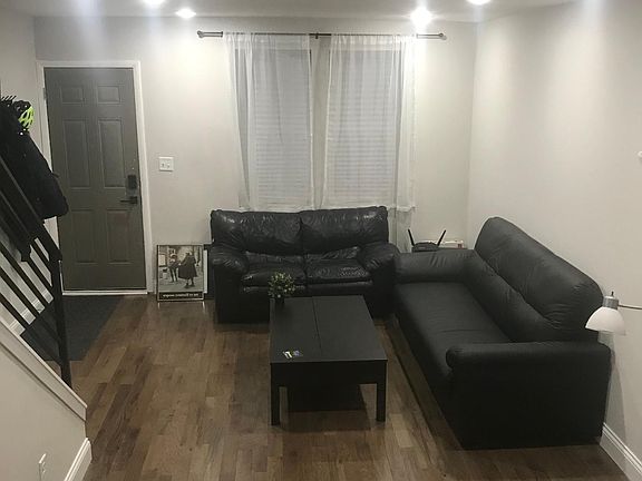 Fully Furnished Living Room with two couches, kitchen table, and coffee table with BUILT IN STORAGE