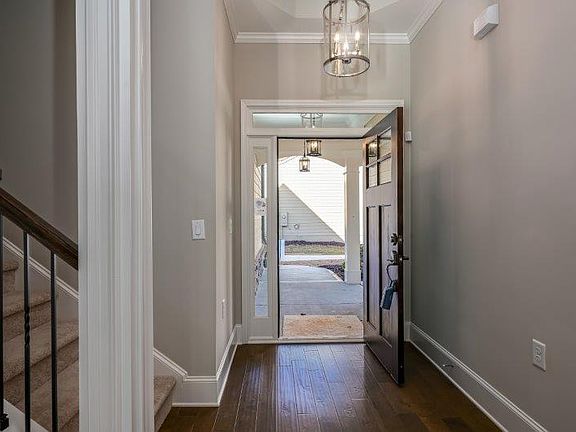 Grand Entry with tall ceilings! Photo is a representation of home.
