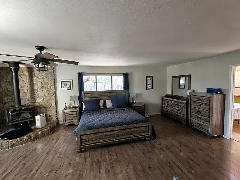 Master bedroom with wood stove
