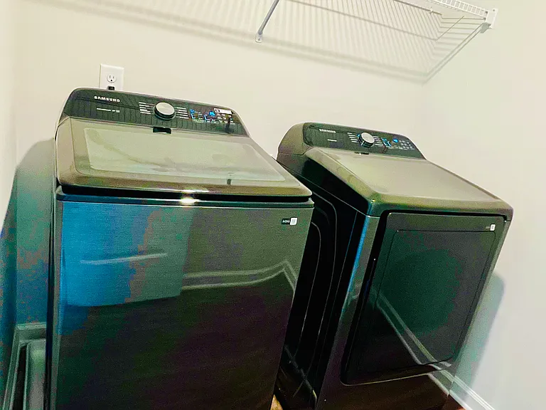 Laundry room with Brand New Washer and Dryer and LVP flooring