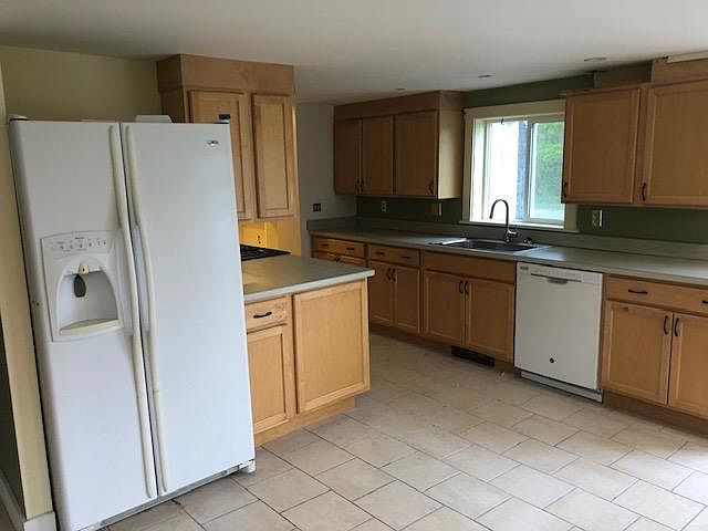 Kitchen to include Refrigerator, Stove and Dishwasher