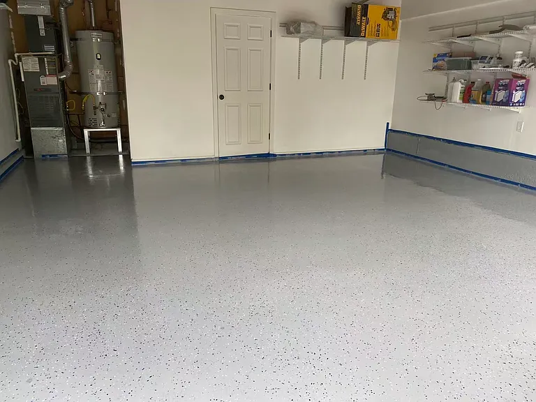 Garage with Epoxy and Storage Shelves. New water tank