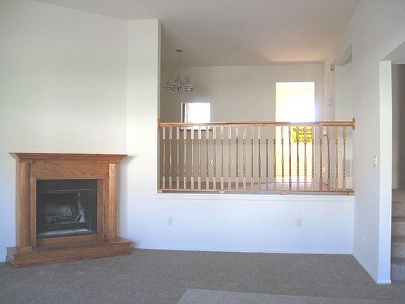 Wood burning fireplace in sunken living room