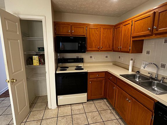 Kitchen - microwave, 4 electric burner stove and oven, new refrigerator/freezer.