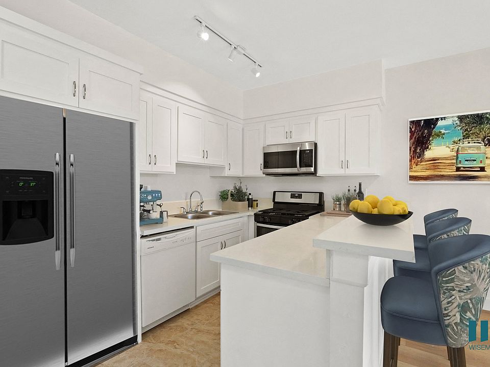 Kitchen with Stainless-Steel Dishwasher, Stove, and Microwave Oven