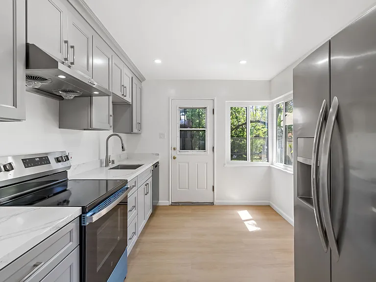 Brand new kitchen with stainless steel appliances
