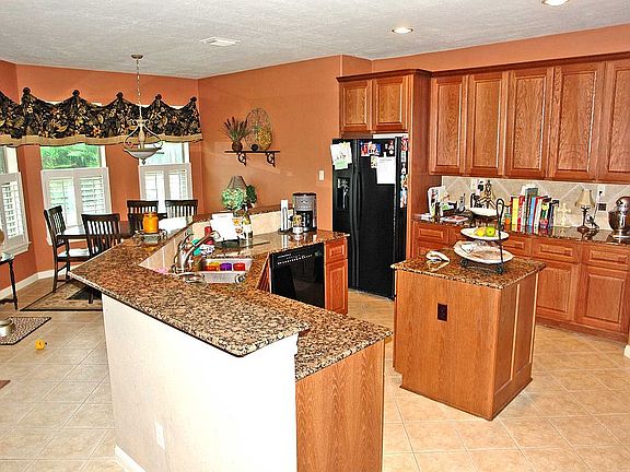 Spacious kitchen is open to the charming breakfast area.