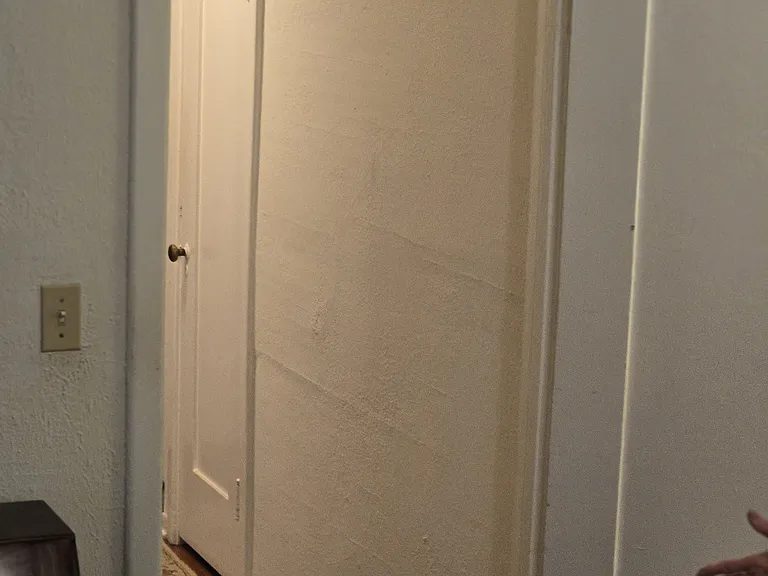 Hallway from second bedroom to the first bedroom and then to the living room