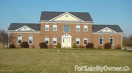 Front view from drive
						:
						Colonial home, sitting on 4.39 acres.