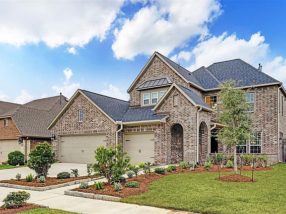 This home shows like a model with fabulous curb appeal with mature landscaping and a covered entry with a private courtyard.
