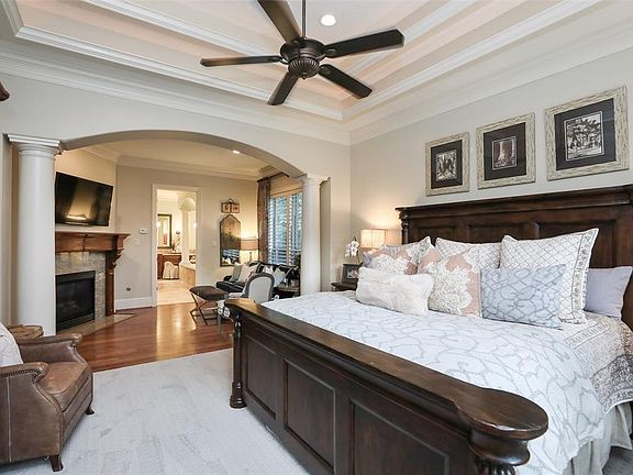 Master Bedroom alternate view looking from the windows toward the sitting area and master bathroom.