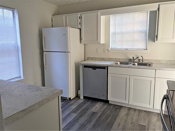 New dishwasher, kitchen cabinets, and counter top