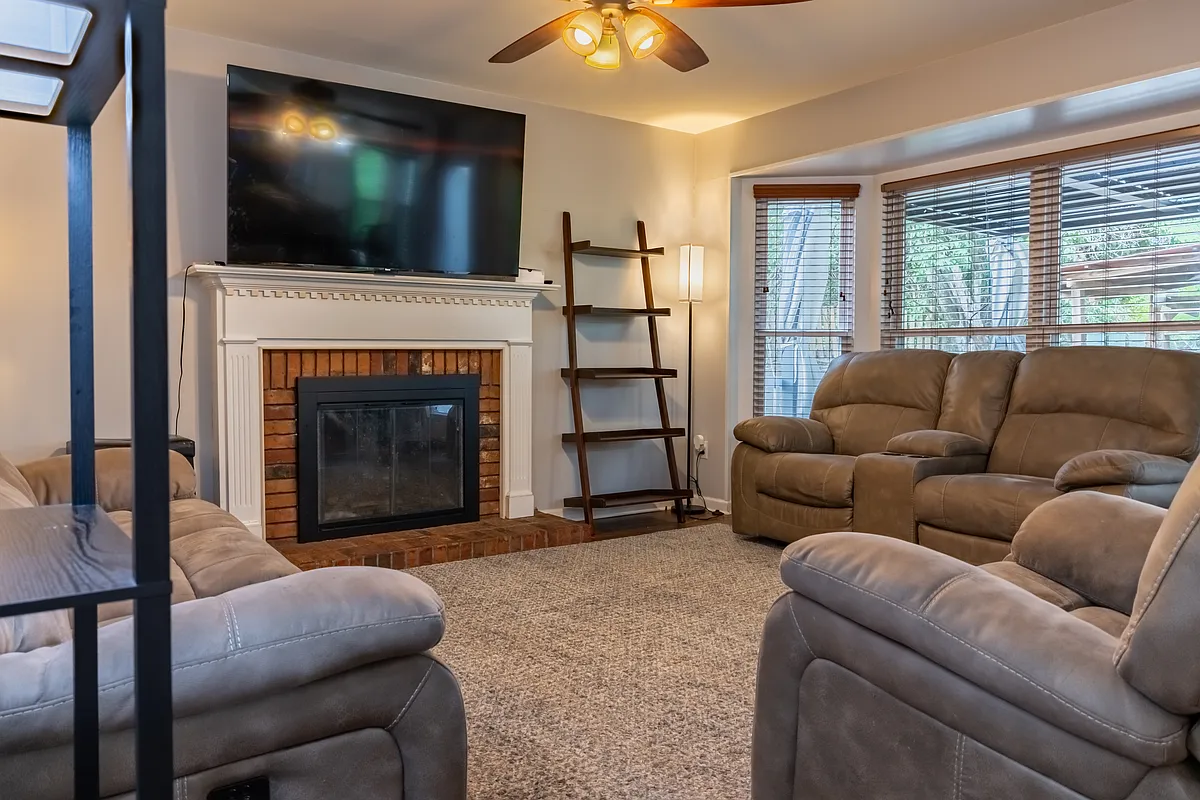 Family Room with Fireplace, View of Backyard and TV - 111 Whitehirst Ct E