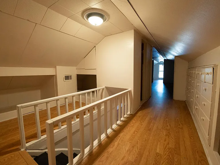 Top of stairs - attic Room 1