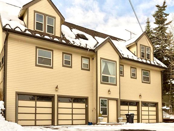 Duplex has enclosed parking for two cars and space for 2 cars outside. Interior garage has been used as an artist's studio and work space.