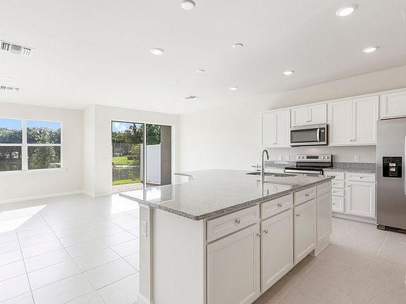Model Representation Easy flow-through layout between kitchen and gathering room