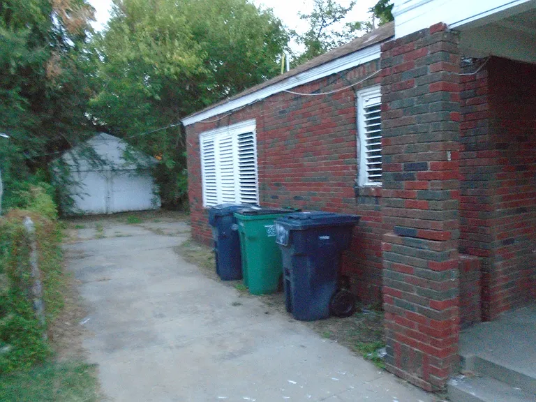 East side of 124 NW 31st Street, with a far view of the detached garage.