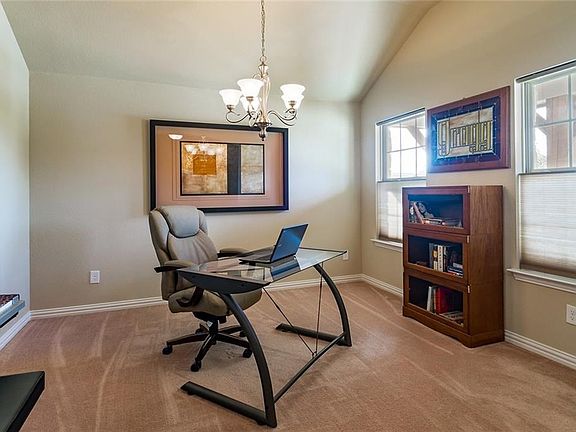 This room is to the right of the front door as you enter and has windows looking out onto the landscaped front yard. This  room can be used as a formal dining room, living room, office or playroom.  Carpet.