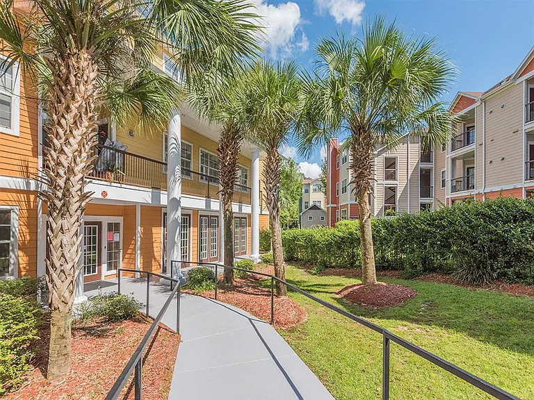 Walkway through the Evergreens at Mahan apartment community