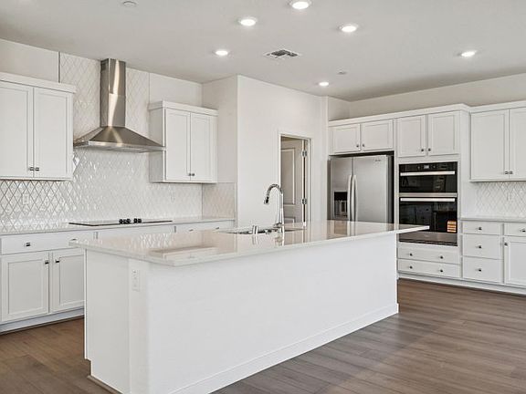 Kitchen with chef s appliance package and upgraded diamond tile backsplash