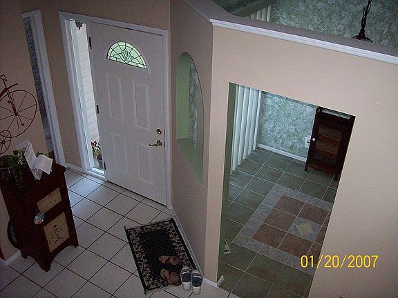 view to downstairs entry/eat in kitchen area