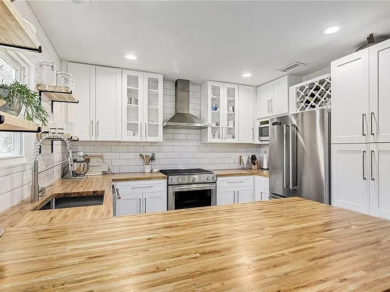 Updated Kitchen with New Appliances, Butcher Block Counter tops, Great Storage, Floating Shelves