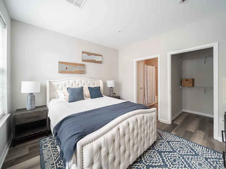 a bedroom with a bed and a closet at Harbor Pointe, Bayonne, 07002