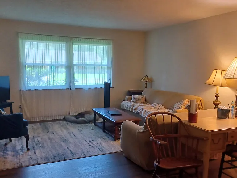 Living Room. Also has a work desk with chairs.