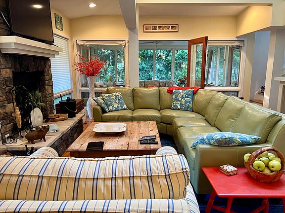living room with wood burning fireplace