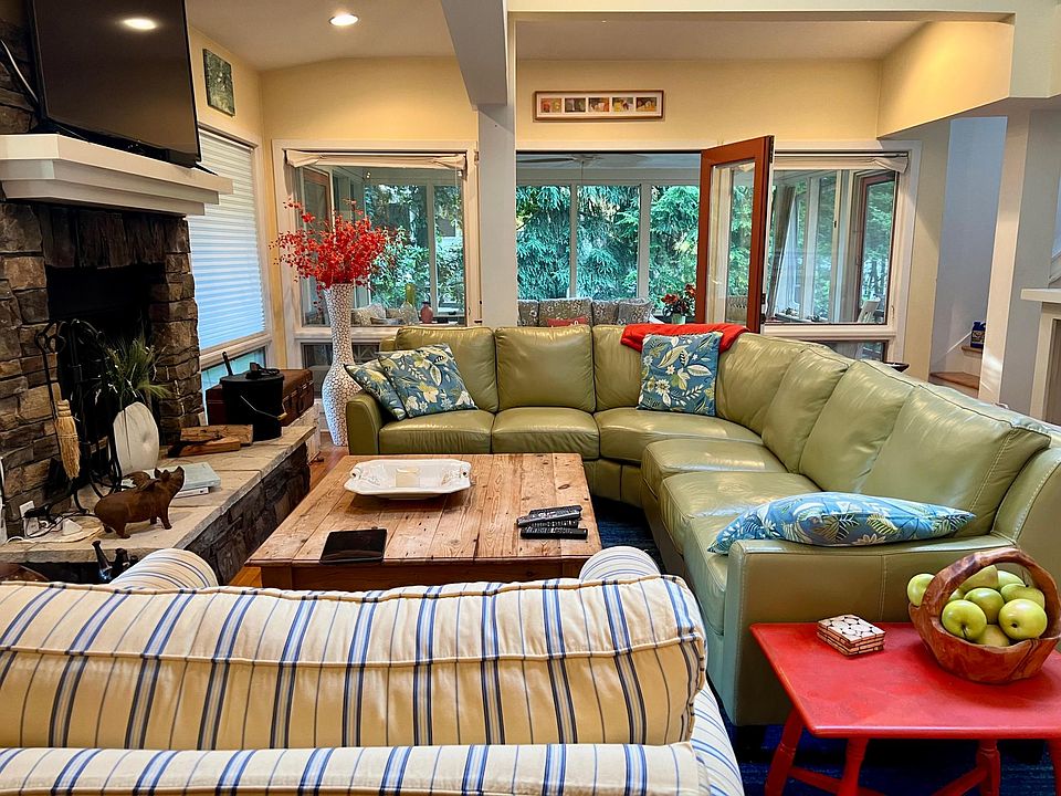 living room with wood burning fireplace