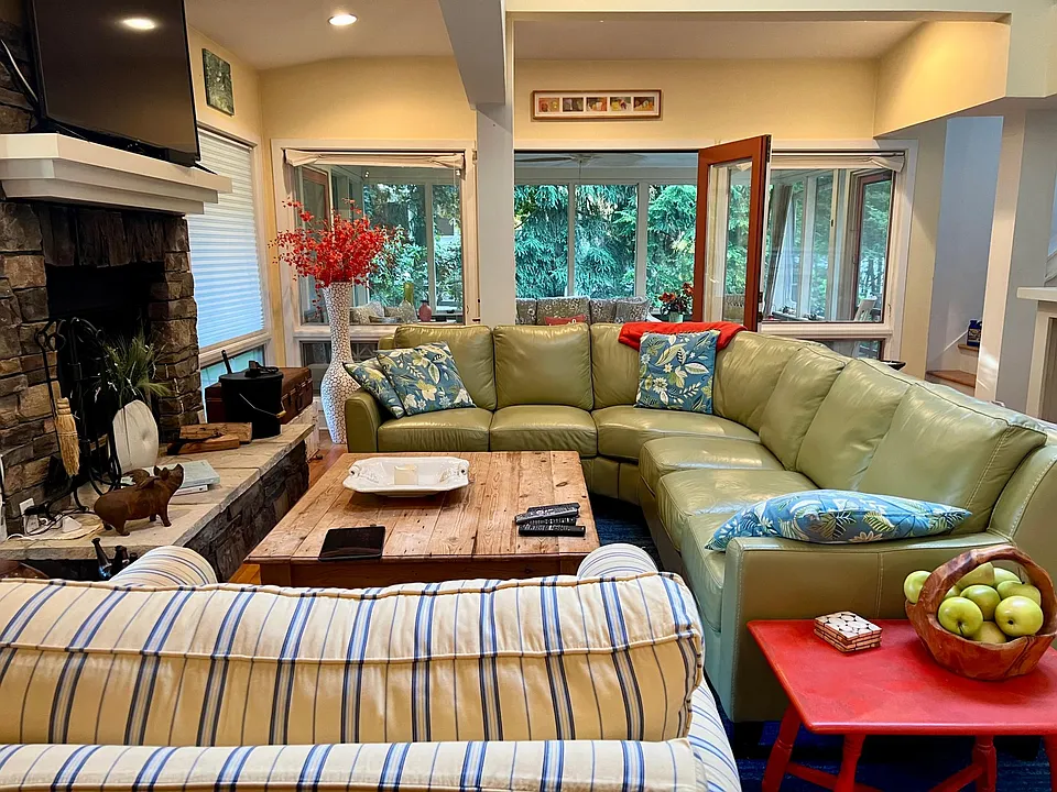 living room with wood burning fireplace