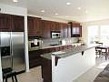 Gourmet kitchen w/gas stove and stainless steel appliances.