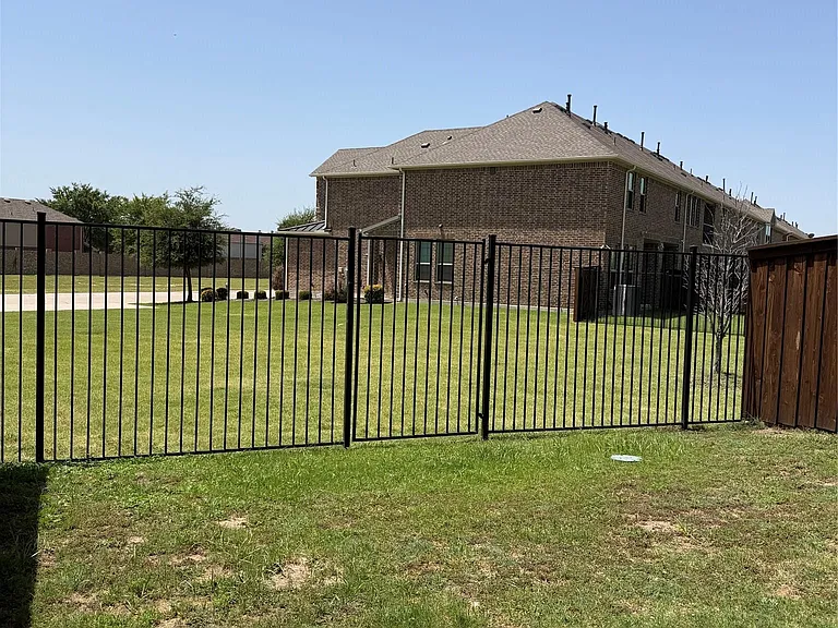 Fenced backyard with view