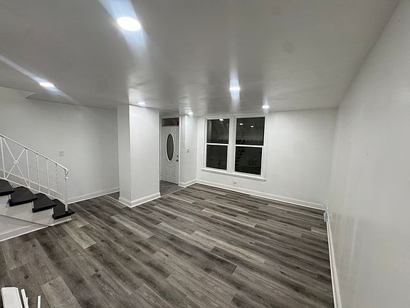 Living Room Angle 1(Beautiful Flooring, Recessed lighting,all new white paint.)