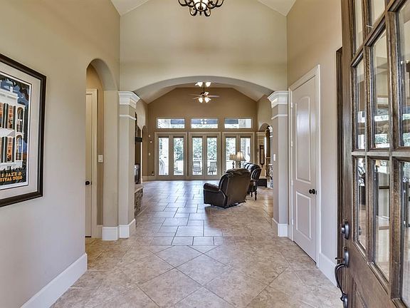 Welcome to 5350 Pine Wood Hills s an exquisite Home located in Benders Landing Estates, The elegant entry is enhanced by Tile floors.