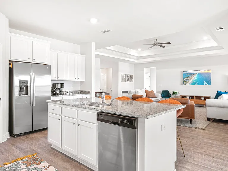 Open kitchen to living space with indoor seating for 10.