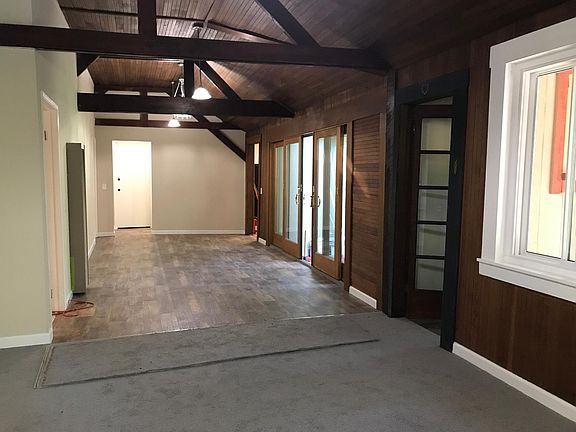 Living room, bonus room and dining room.