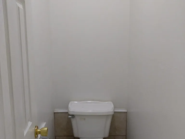 Toilet which serves all the basement bedrooms. It is in its own room for efficiency.