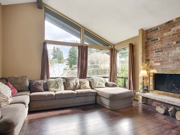 Great living space with vaulted ceilings,wood burning fireplace & tons of natural light!