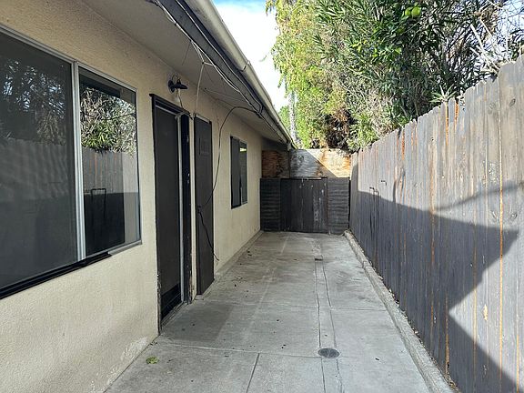 Private enclosed patio with gate in the back.