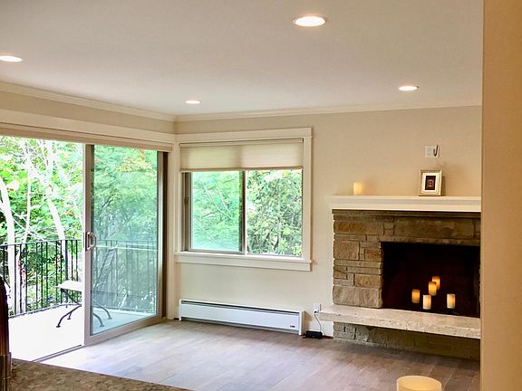 View of living room and balcony from open kitchen