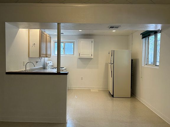eat-in kitchen separate from main living area 
full size refrigerator