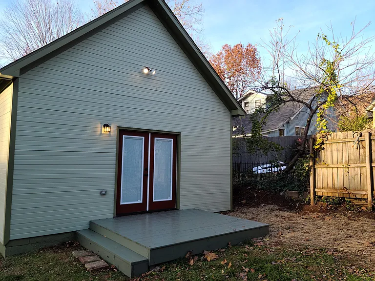 Rear deck off back bedroom in fenced in backyard