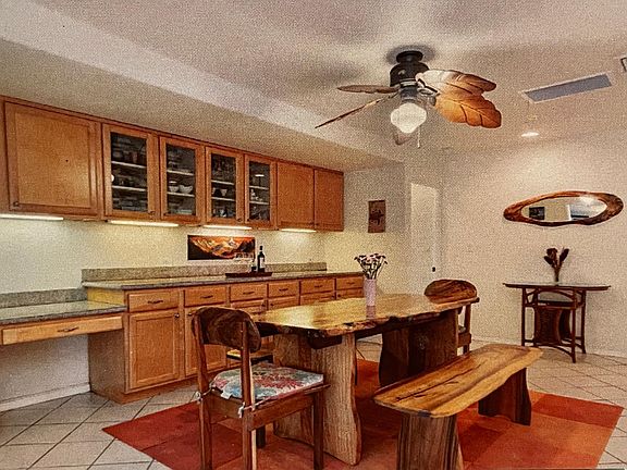 Large dining area, open to kitchen, with built in shelves and work area